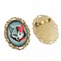 Detailed view of oval alloy brooch base featuring unique anime wolf girl art pattern. - B3-19 / 30x40mm Inner Diameter