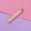 Closeup of rose gold polished stainless steel rectangular blank pendant DIY jewelry accessory - Rose Gold