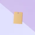 Detailed shot of a smooth gold rectangular stainless steel DIY pendant blank charm accessory. - Gold