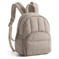 Close-up detail of beige quilted puffer backpack, vertical stitched design with zipper pocket. - Camel