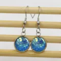 Stainless steel fish scale drop earrings detailed view, showing iridescent blue round cabochons. - 12mm / 5