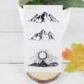 Vintage mountain and sun waterproof temporary tattoo sticker variant in black and white. - RC-554