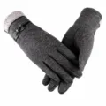 Close-up of grey fleece-lined knit women's gloves with cute bow and touch screen design. - Grey