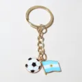 Gold alloy metal keychain featuring a cute soccer ball and Argentina flag charm. - Argentina Flag