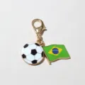 Detailed view of a metal enamel Brazil flag and soccer ball charm with lobster clasp for DIY crafts. - Brazil Flag Style (SG-D5-30-AB1-02)