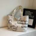 Close-up detail view of casual canvas tote bag featuring cute cat graphic and print. - Little Mouse Gray Off White
