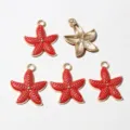 Closeup of red enamel starfish alloy pendants, showing front and back details for DIY jewelry. - D6-25