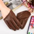 Detailed view of brown PU leather women gloves, perfect for stage performance and club wear. - Brown
