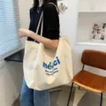 Detailed shot of casual canvas tote bag with blue print, large capacity for daily use. - ME Style / White