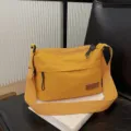 Yellow canvas crossbody bag multi-layer compartment large capacity casual shoulder bag detail view. - Yellow