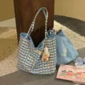 Detail view of the large canvas tote bag with blue wave print and cute chef pendant. - Blue Red Dot Large Bag