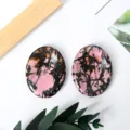Natural rhodonite worry stones pair, polished oval massage palm stones for stress relief decoration. - Rhodonite