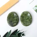 Natural green jade worry stone, oval thumb massage crystal for stress relief and palm play. - Xiuyan Jade
