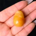 Natural crystal stone egg ornament, yellow polished jade gemstone for home decor and gift. - Topaz