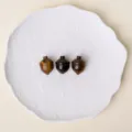 Natural crystal stone carved acorn mini ornament, gemstone hazelnut figurine variant. - Tiger's Eye