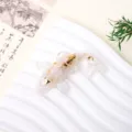 Resin crystal koi fish figurine with gold flakes, perfect for car dashboard or desktop home decor. - White Moonstone