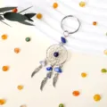 Llavero atrapasueños de cristal natural con plumas metálicas y colgante de piedra lapislázuli. - Lapislázuli
