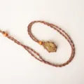 Collana di cristallo con tasca in rete intrecciata a mano e ciondolo in pietra gialla marrone. - Citrino + Tasca in Rete Marrone