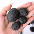 Natural black meteorite rough stone raw mineral specimen volcanic rock crystal home decor item - 100g (Approx. 4-7 pcs)