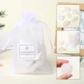 Clear quartz rough stones in white mesh gift bag. Natural crystal mineral for home decor. - Clear Quartz Raw Stone Gift Bag