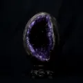 Natural amethyst geode crystal cluster egg ornament with carved wooden base for home decor. - No.4 Dinosaur Egg Amethyst Cluster Ornament With Base