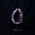 Natural amethyst geode crystal egg ornament with wooden base for luxurious home decor. - No.1 Dinosaur Egg Amethyst Cluster Ornament With Base