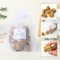 Natural Tiger's Eye rough stones packed in an elegant white organza gift bag for healing. - Tiger Eye Raw Stone Gift Bag