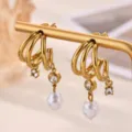 Stainless steel 18k gold plated multi-layer hoop earrings with faux pearl and crystal charms. - E7342G
