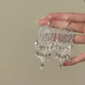 Exquisite dreamcatcher crystal tassel earrings detail shot, elegant silver jewelry accessory. - Silver