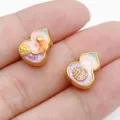 Perlina distanziatrice a zucca smaltata dorata per creazione di bracciali gioielli fai - Perla Zucca Carattere Fu Koi (28535) / 1 Pezzo (12.5x10x6mm) / Rosa