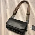Men's stylish black PU leather crossbody bag with patterned woven strap for casual daily use. - Black