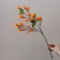 Orange artificial orchid flower branch silk floral stem for DIY crafts and decor view. - Orange