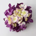 Detailed shot of an artificial hydrangea flower head in purple and white for DIY decor. - Deep purple