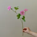 Detailed view of artificial pink flower branch, perfect for DIY crafts and floral arrangements. - Deep Pink