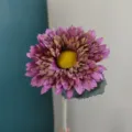 Artificial sunflower detail shot, purple plush flower head, realistic silk floral decor. - Pink Purple