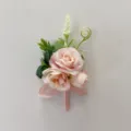 Pink artificial rose boutonniere detail shot, elegant wedding floral accessory for bride. - Corsage