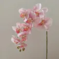 Close-up of artificial pink orchid flower branch with realistic petals and stem details. - Pink
