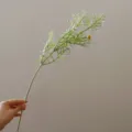 Close-up detail of flocked artificial green plant branch, ideal for DIY floral arrangement. - Single Stem