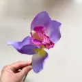 Artificial silk cymbidium orchid flower head detail, ideal for home decor and floral arrangement. - Purple