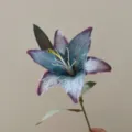 Detail view of a 3D printed retro blue lily artificial silk flower stem decor. - Blue Purple
