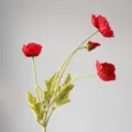 Artificial red poppy flower branch with four flocked heads for home decor and arrangements. - Red