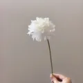 Detail shot of a single white artificial dahlia flower with green stem, ideal for DIY crafts. - White