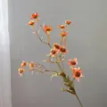 Close-up detail of artificial autumn chamomile flower branch, retro orange daisies. - Orange