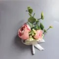 Pink artificial flower boutonniere for wedding groom and bride with green leaves and white ribbon. - Style XH091