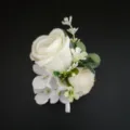 Close-up detail of elegant white artificial rose boutonnière for wedding groom suit. - Style 1