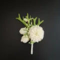 White groom boutonniere artificial flower detail shot, elegant wedding floral accessory. - Style 2