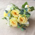 Detailed view of artificial yellow rose bouquet with green leaves for nice craft and home decor. - Yellow