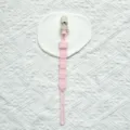 Silicone pacifier clip detail view, cute cartoon animal design, safe baby accessory closeup. - Plastic Clip Style / Light Pink