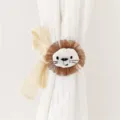 Detail shot of cute cartoon lion curtain tieback with fringe mane and beige bow for decor. - Brown Lion / 79*5*0.1cm