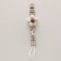 Handmade knitted flower pacifier clip for babies, anti-drop fabric teething strap detail. - Beige Floral Plaid